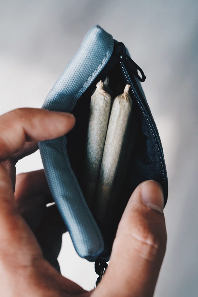 Pre rolled Joints in a tiny blue wallet